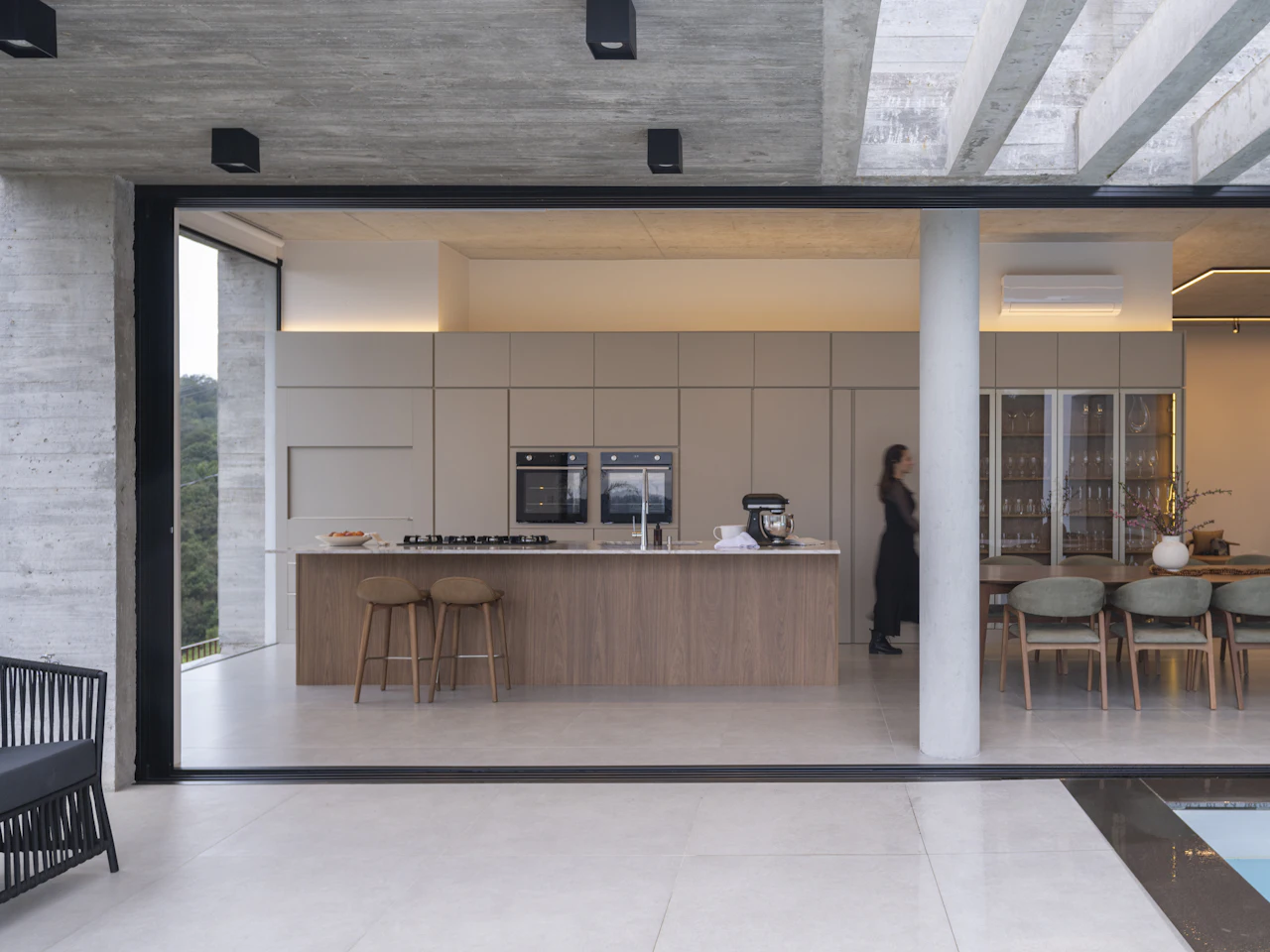 Open kitchen and dining room opening onto a terrace