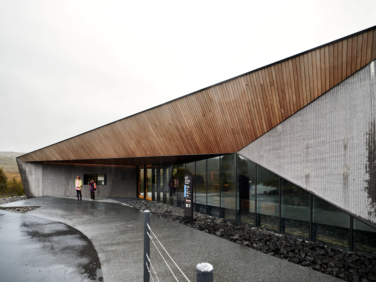 Concrete building with a timber soffit and long glazing